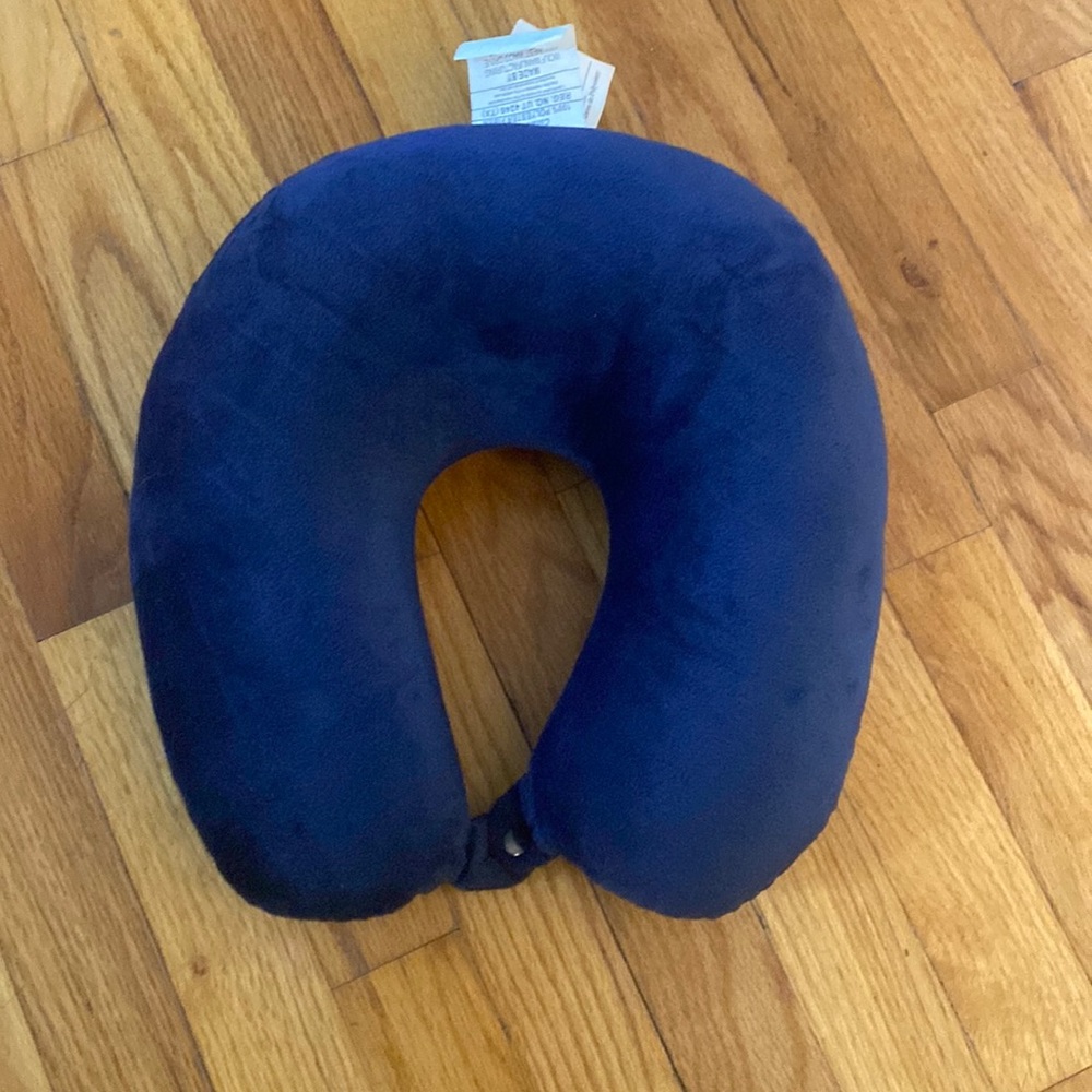 Soft blue travel neck pillow with button clasp